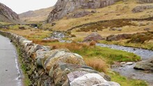 Video, The Llanberis Pass Near Snowdon, Snowdonia, North Wales, UK. Focus On Wall In Foreground.