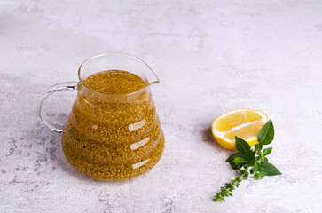 Wall Mural - Yellow drink with seeds in a glass