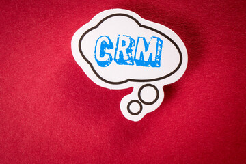 Wall Mural - CRM Customer relationship management concept. Speech bubble on red background