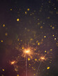 Happy New Year, Sparklers burning bright with shiny sparks and bokeh festive silvester party vertical background