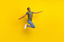 Full Body Photo Of Overjoyed Person Jump Fly Have Good Mood Isolated On Yellow Color Background