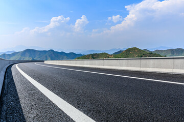 Asphalt highway and mountain with sky cloud scenery