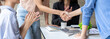 © crizzystudio - Group of Asian businesspeople shaking hands clapping and smiling while working in the creative office, Business team applauding during the conference in the office