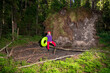 © VISTA by Westend61 - Woman with inflatable ring standing in forest