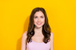 Portrait of positive minded lady beaming smile look interested up empty space isolated on yellow color background