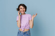 White young woman gesturing while talking on cellphone