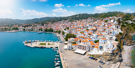 Wall Mural - panoramic view of the beautiful town of skopelos island with white houses and red roofs, sporades, g