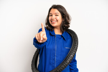 Wall Mural - hispanic pretty girl feeling stressed, anxious, tired and frustrated. bike mechanic concept