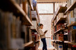 © qunica.com - Girl leaning on the bookshelves