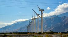 View Of Wind Turbines Generating Electricity. Huge Array Of Gigantic Wind Turbines Spreading Over The Desert In Palm Springs Wind Farm, California