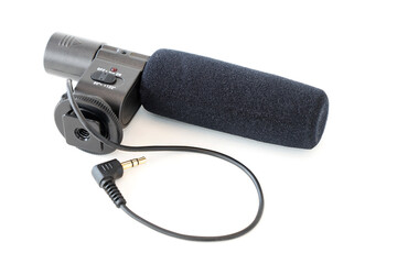 Microphone with cable for recording the sound of a video camera on a white isolated background