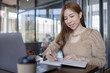 © David - Freelancer Business asian woman or study online asian girl student having coffee and doing har work in cafe.