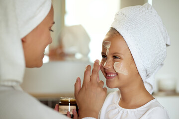 Poster - Fresh skincare, face cream and healthy skin product for mother and daughter home spa day. Fun, smiling and playful child and a parent applying moisturizer for grooming routine or sunscreen protection