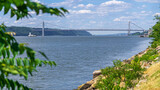 A view of the George Washington Bridge as seen from the edge of the Henry Hudson River walkpath
