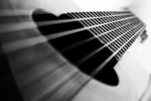 Classical Guitar Strings And Frets On White And Black Background
