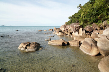 Lanscape nature brown rock stone on Crystal beach or Silver beach is beautiful White sand beach and blue sea and brown stone - famous for traveler sunbath and swimming - travel outdoor and activity