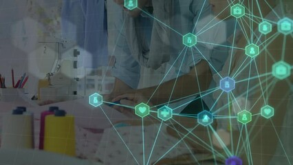 Poster - Animation of network of medical icons against two male and female fashion designers discussing
