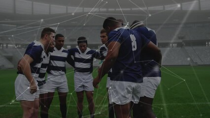 Canvas Print - Animation of network of connections over team of diverse male rugby players discussing together