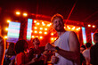 © bernardbodo - Young man moving to the music with friends at he concert