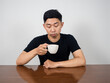 © Thanasak - Asian man feels sleepy hold coffee cup at morning