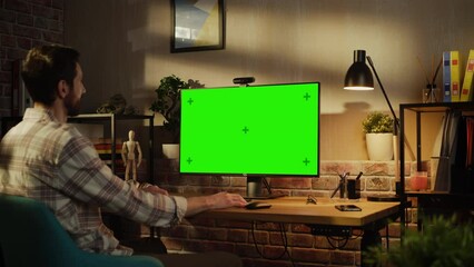 Aufkleber - Office Employee Working from Home, Talking on Video Call on Desktop Computer with Monitor with Green Screen Mock Up. Man Sitting in Living Room, Chatting Online with Friends and Family in the Evening.