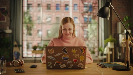 Leinwandbilder - Attractive Young Woman Using Laptop Computer while Sitting in Stylish Cozy Living Room. Female Shopping Online from Home. Browsing Internet, Using Social Networks, Writing Project.