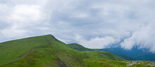 Green Mountain Ridge In Dense Cumulus Clouds, Summer Travel Background