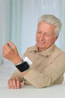 © aletia2011 - Senior man using automatic carpal tonometer in hospital
