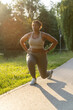 © gpointstudio - Plus sized African American woman exercising at the park in a  summer day