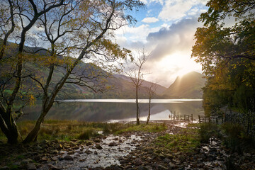 Poster - Views of Fleetwith Pike at sunrise across Buttermere in Autumn in the Lake District, UK.