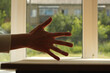 Young man right hand on a window background. Pavel Kubarkov, my right hand on a green background. Photo was taken 16 July 2022 year, MSK time in Russia.