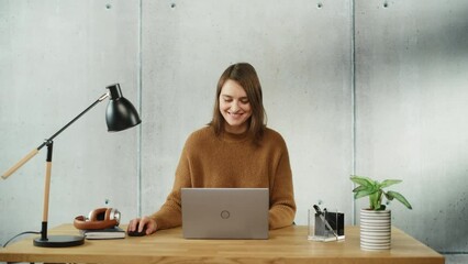 Leinwandbilder - Professional Creative Smiling Woman Sitting at His Desk in Office Working on a Laptop Computer. Modern Minimalistic Design Office: Productive Successful Businesswoman Works on e-Commerce Project