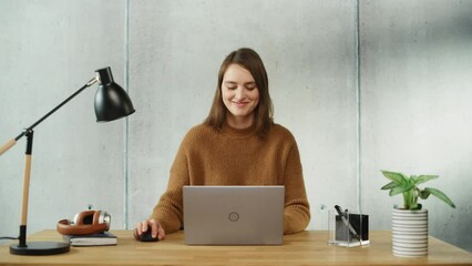 Leinwandbilder - Professional Creative Woman Sitting at His Desk in Office Working on a Laptop Computer. Modern Office Space Design Perfect for Productive Businesswoman Works on e-Commerce Project. Static Shot