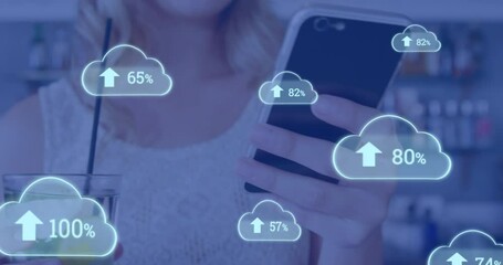Poster - Animation of cloud icons with growing numbers over caucasian woman using smartphone