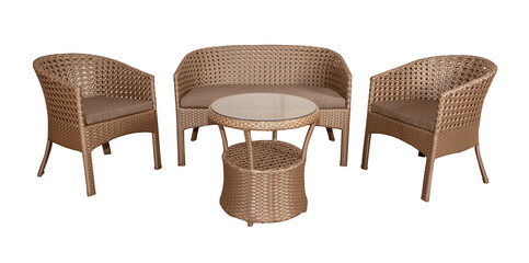 Set of wicker rattan furniture for the garden or terrace. Comfortable sofa and two armchairs with soft pillows and a coffee table.