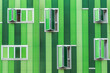 © ADDICTIVE STOCK - Modern green building with opened windows