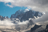 Fototapeta  - The Mont Blanc massif in the evening light and clouds.