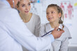 © lenets_tan - Girl and doctor with stethoscope listening to heartbeat