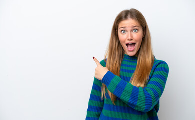 Young caucasian woman isolated on white background surprised and pointing side