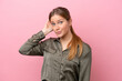 © luismolinero - Young caucasian woman isolated on pink background with an expression of frustration and not understanding