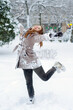 © Solid photos - Beautiful smiling teenage girl playing in the winter snow