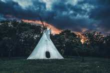White Teepee Indian Tent Standing In Beautiful Landscape.