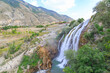 Tortum (Uzundere) waterfall from the side with people in Uzundere, Erzurum, Turkey