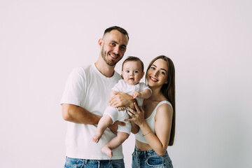 Happy young father, mother and cute baby boy, family over white background