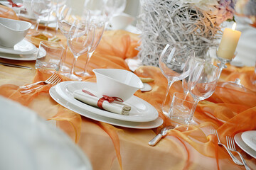 Wall Mural - Table set in orange organza for a wedding banquet