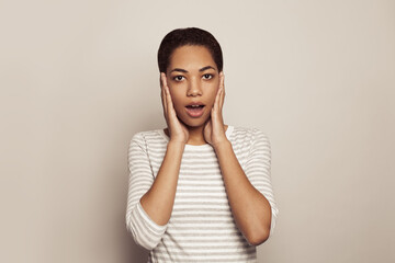 Wall Mural - Happy surprised woman on white background