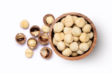 Wall Mural - Macadamia nuts in wooden bowl isolated on white background, top view, flat lay.