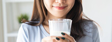 Close Up View Of Asian Woman Drinking Milk.