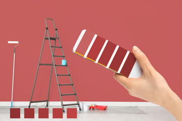 Poster - Decorator holding color palette samples in room with painted wall, closeup. Interior renovation