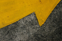 Yellow Arrow On Asphalt